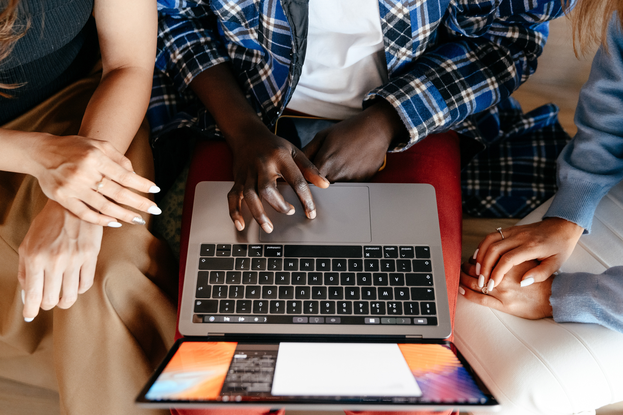 Diverse women chatting online on laptop
